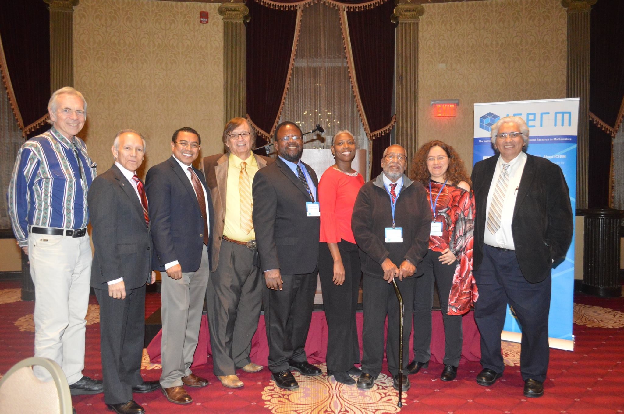 Dr. Ronald E. Mickens (3rd from right) surrounded by some past Blackwell-Tapia prize recipients, friends, and Dr. Richard Tapia (4th from left)