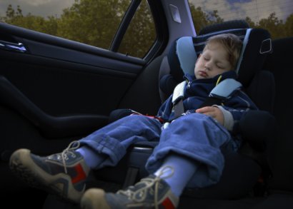 child sleeping in a car seat